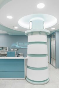 Stylish medical clinic reception area with unique modern design and blue color scheme.
