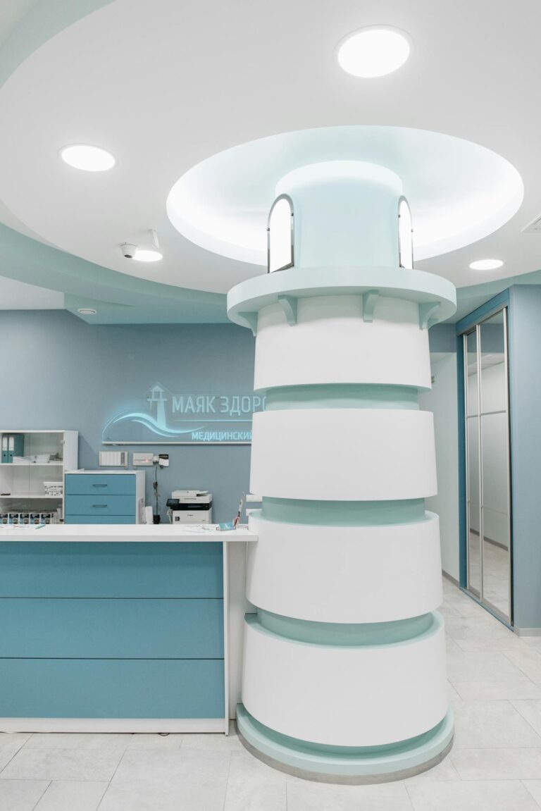 Stylish medical clinic reception area with unique modern design and blue color scheme.